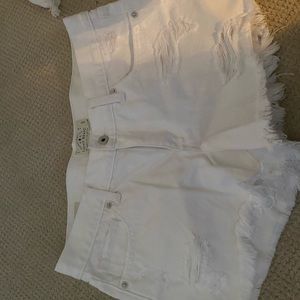 White lightly distressed jean shorts
